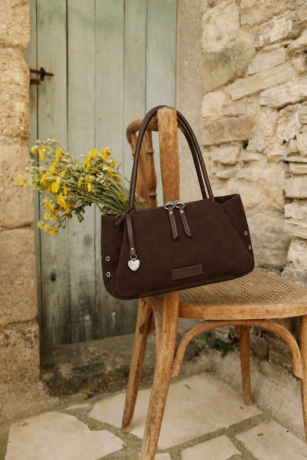 Urban Originals USA Please Stay chocolate brown suede crossbody bag with silver hardware and side stud details